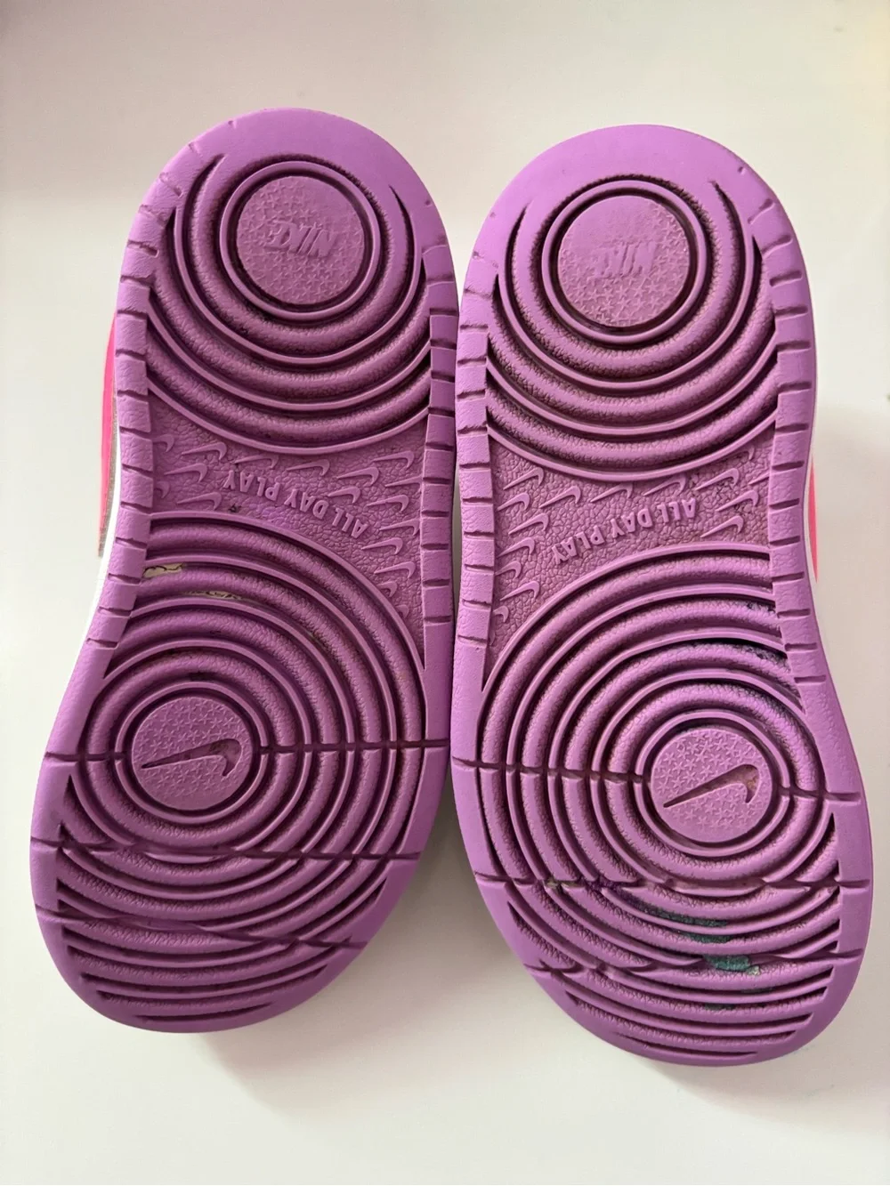 Nike White Sneakers with Bright Pink Swoosh and Lavender Soles